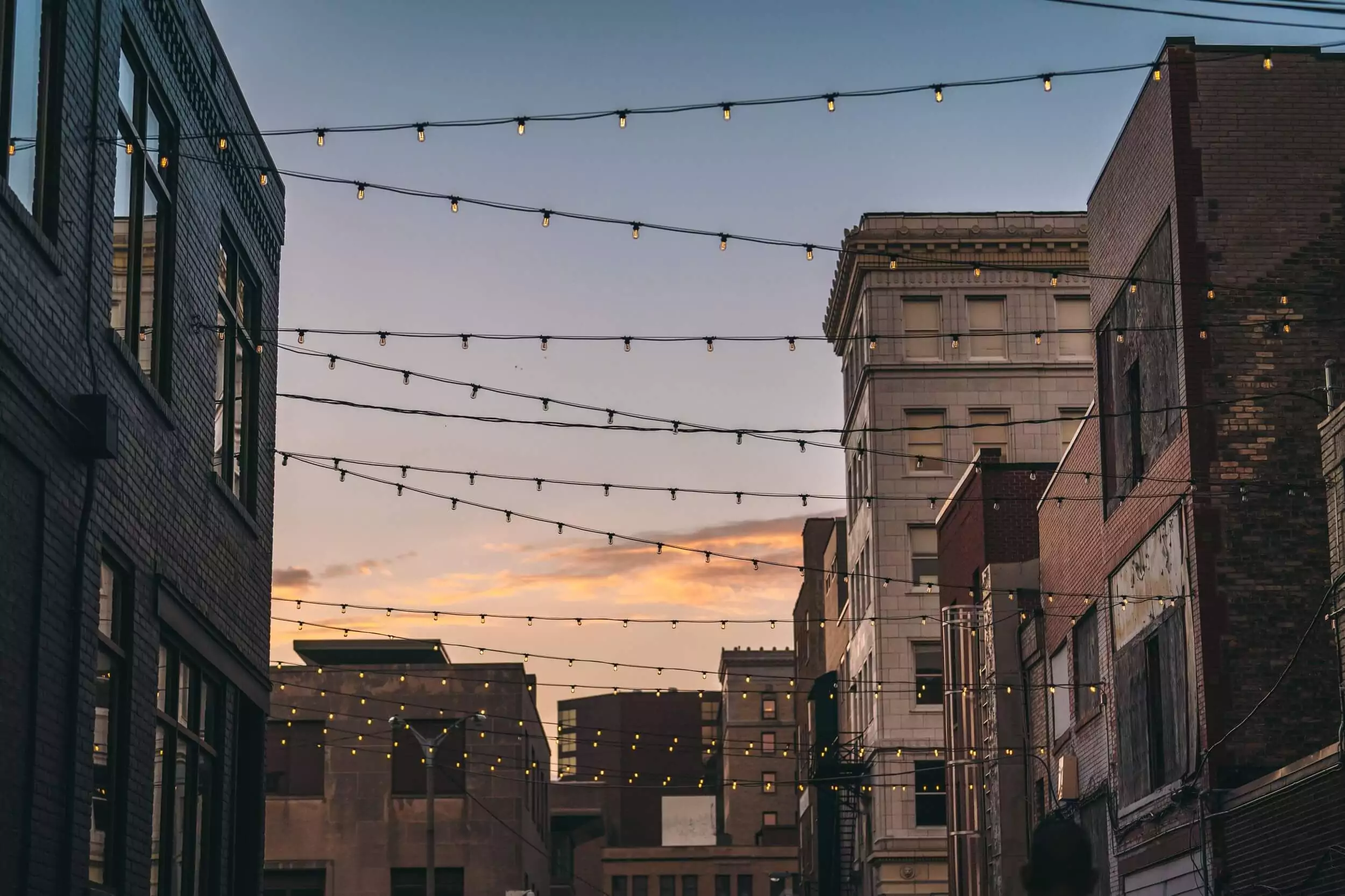 String lights hanging in an alley way during a festival in downtown Flint.