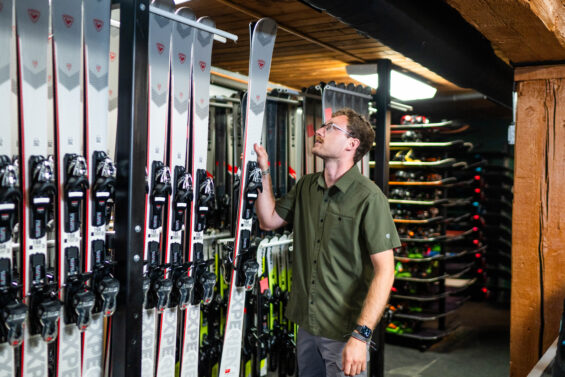 Benjamin looks at skis in resort shop