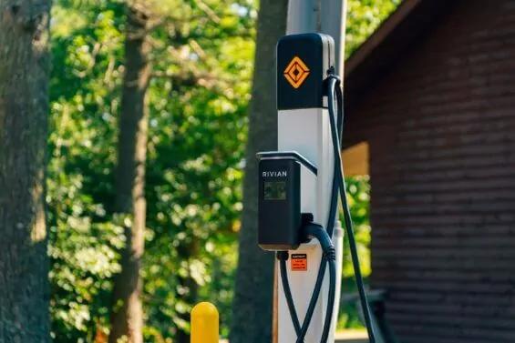 Rivian EV charging station outside on a sunny day.