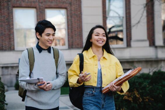 Two students walk together outside of school in Kalamazoo, Michigan.