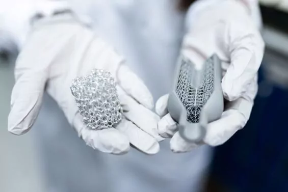 Engineer holding clean energy battery in their hands.