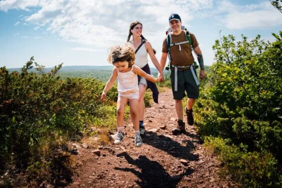 Family walking on Mount Baldy Keweenaw Overlook in Michigan