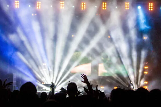 Crowd gathered at music venue to watch a DJ set.