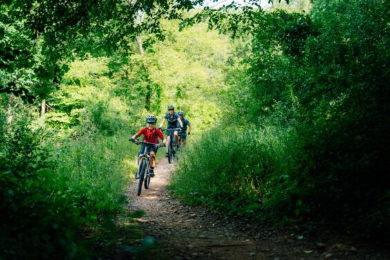 Family bikes outdoors on the DTE Energy Foundation.
